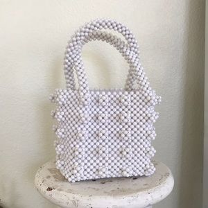 White beaded square purse.